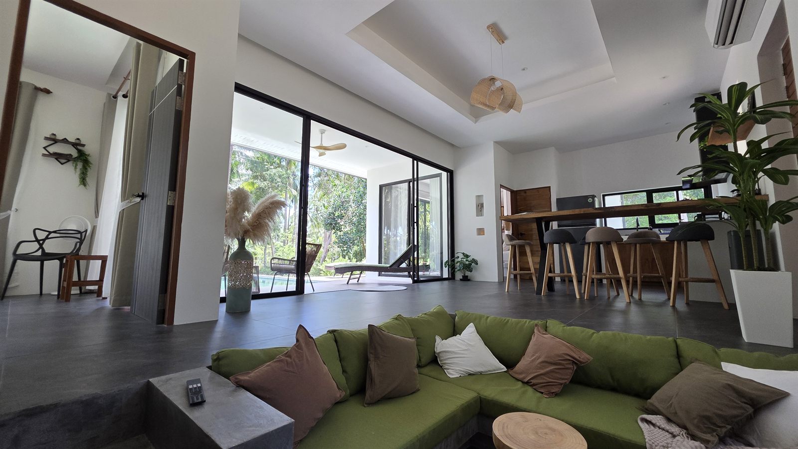 Villa Issanka — living room opening to the pool