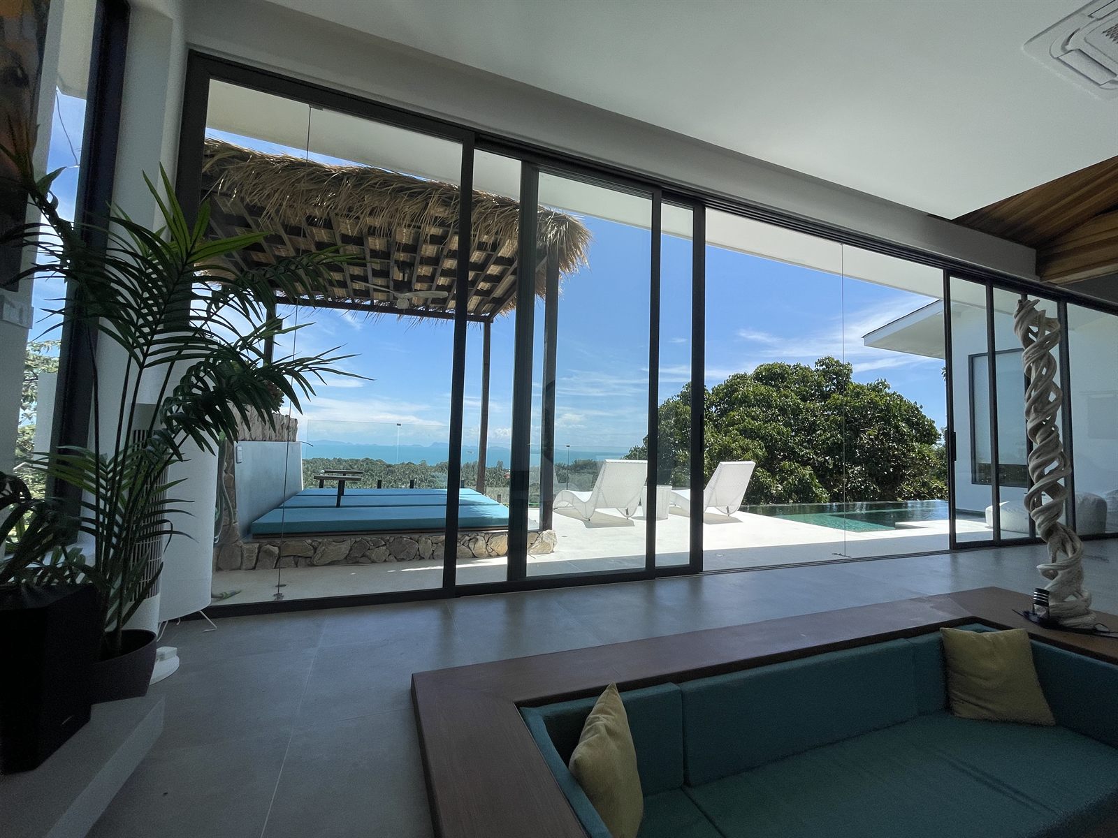 Villa Kiran — living room opening to the pool